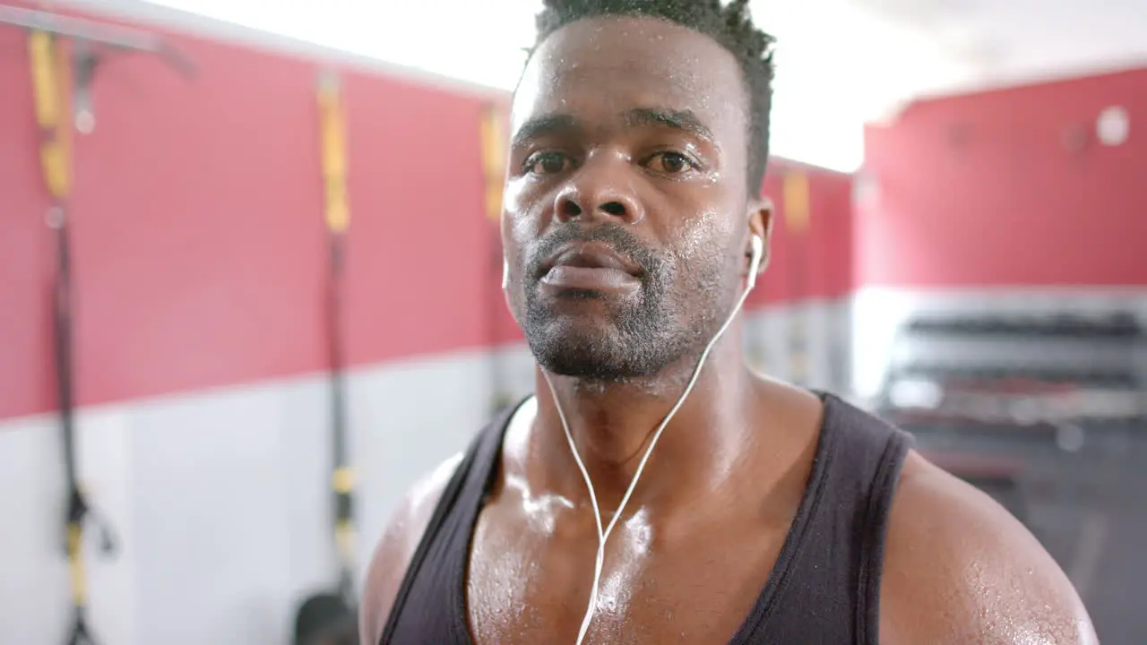 Fit sweaty African American man at the gym