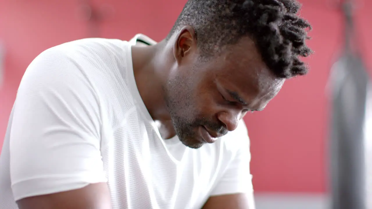 Fit African American man takes a break at the gym