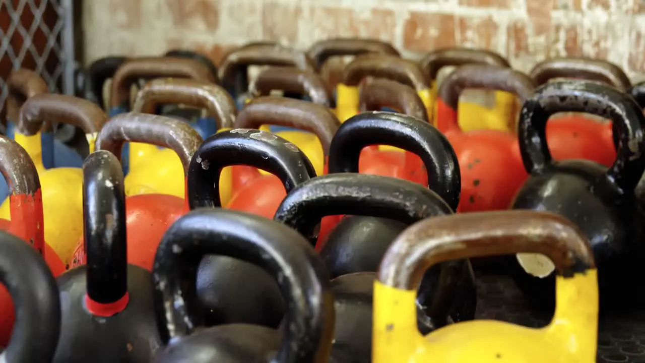 Kettle bells kept on the shelf in the fitness studio 4k