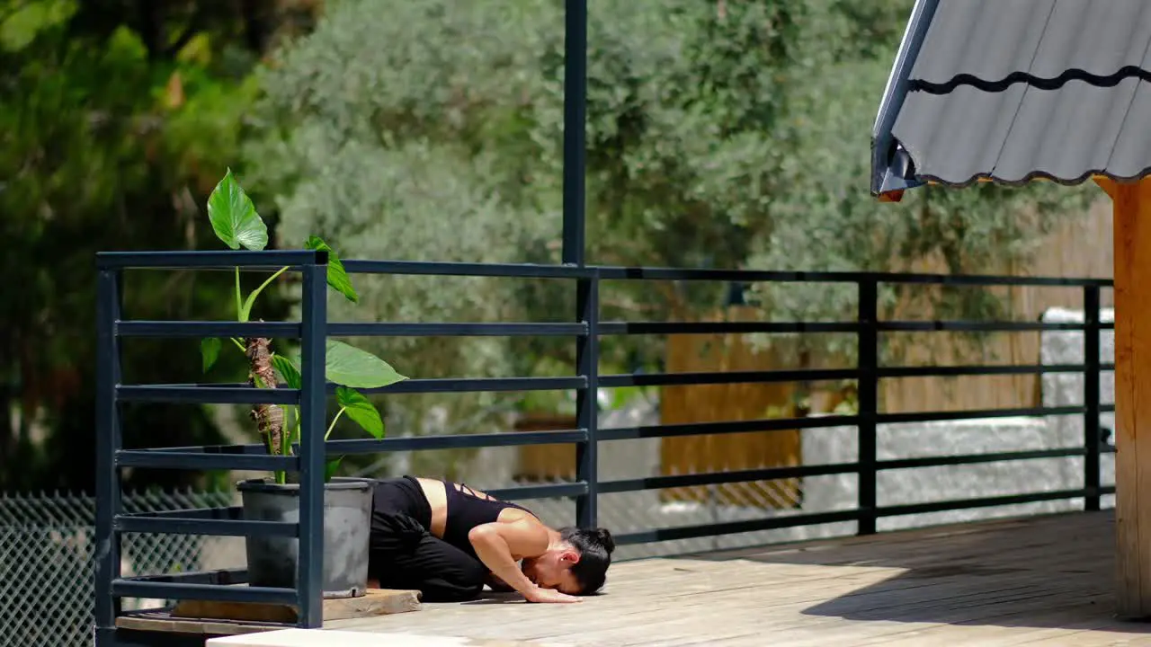 a woman does in the garden in front of gate