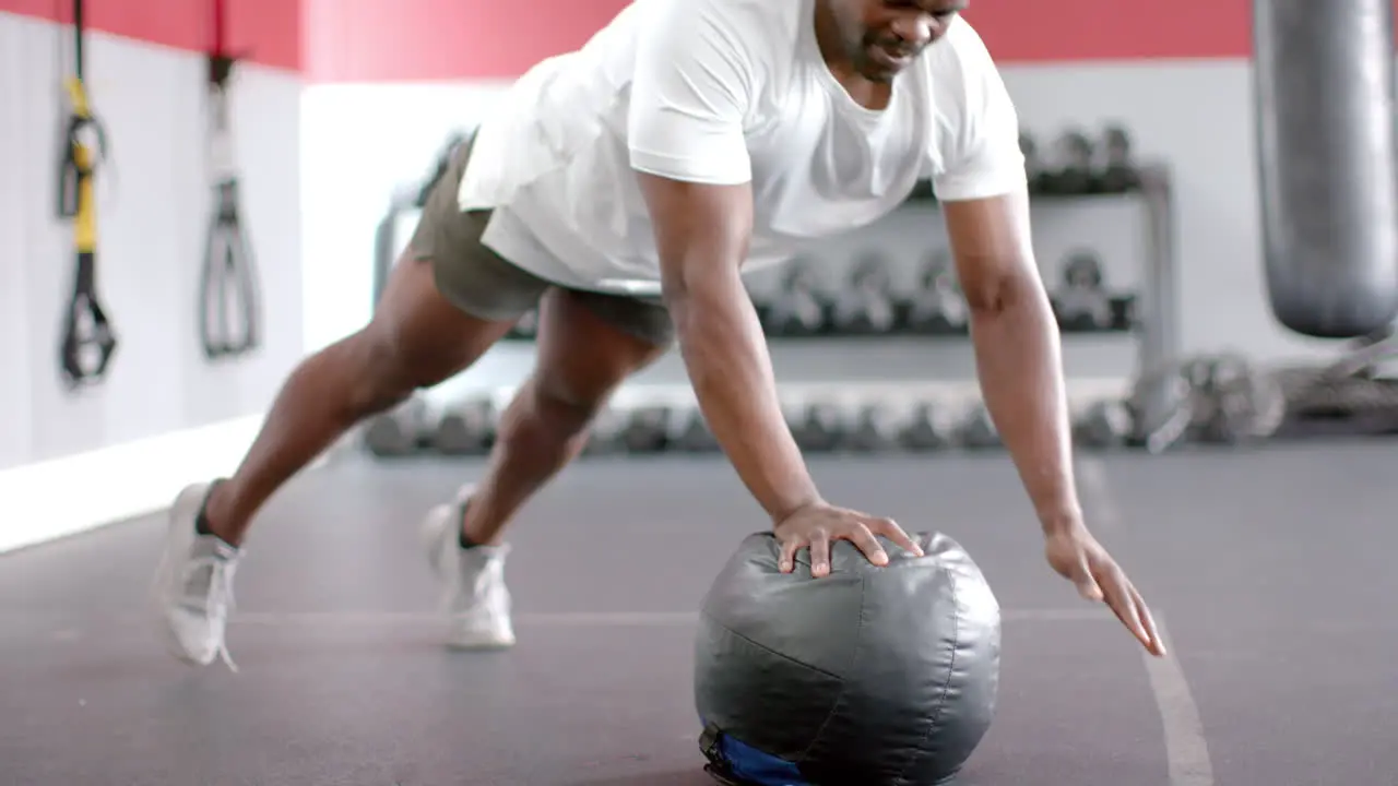 Fit African American man exercising at the gym