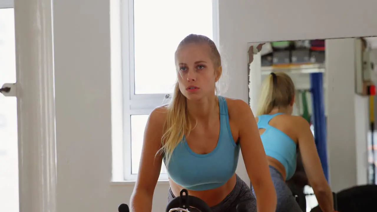 Female boxer exercising on machine 4k