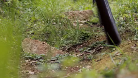 Close Up Of Man On Mountain Bike Cycling Along Grass Trail Through Woodland 2