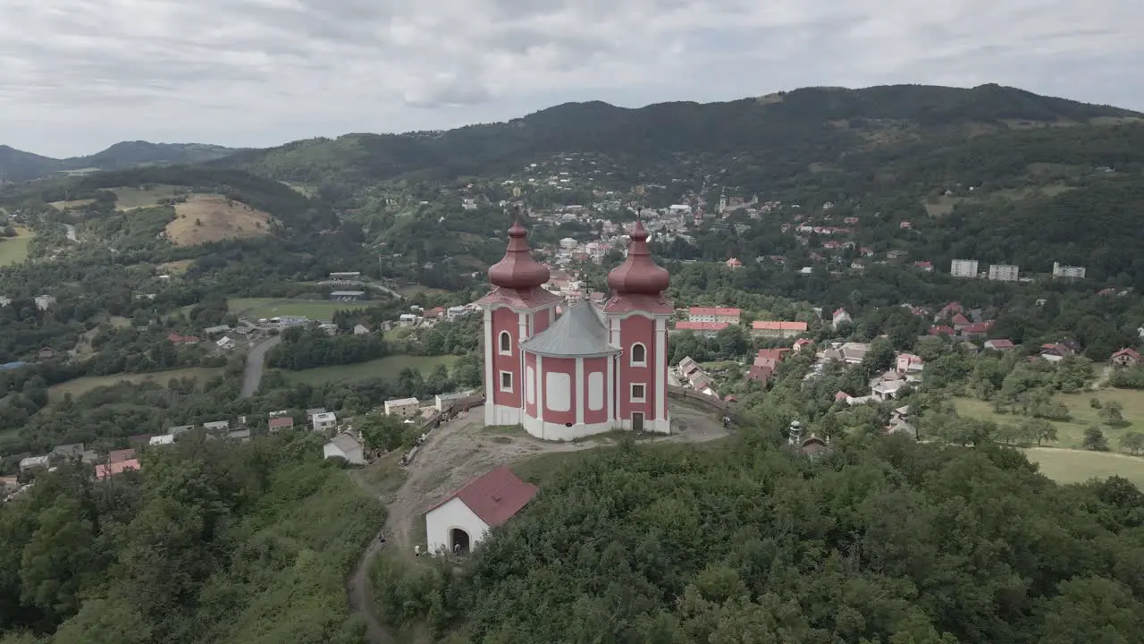 Chapel with view on the small city in the middle of mountains