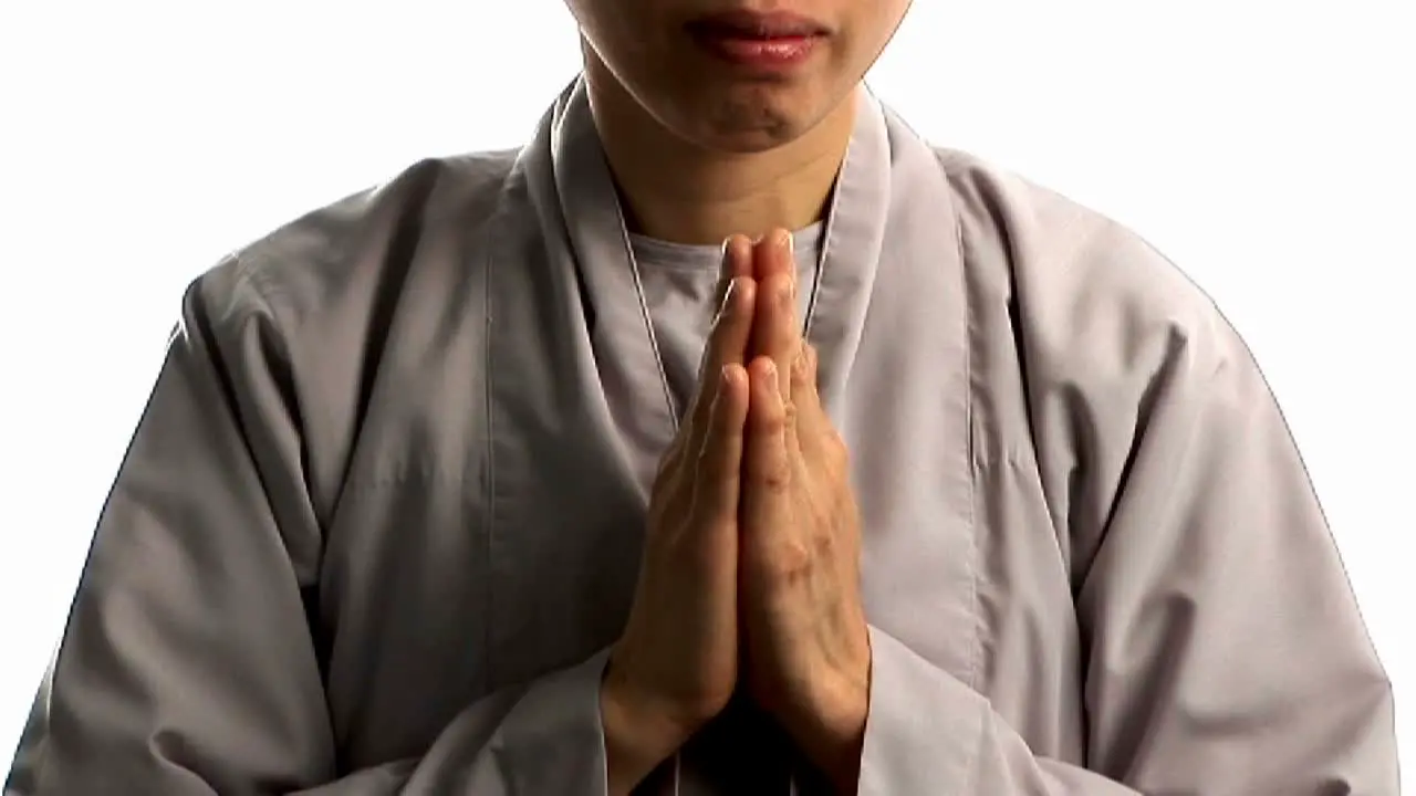 A young Buddhist monk prays 3