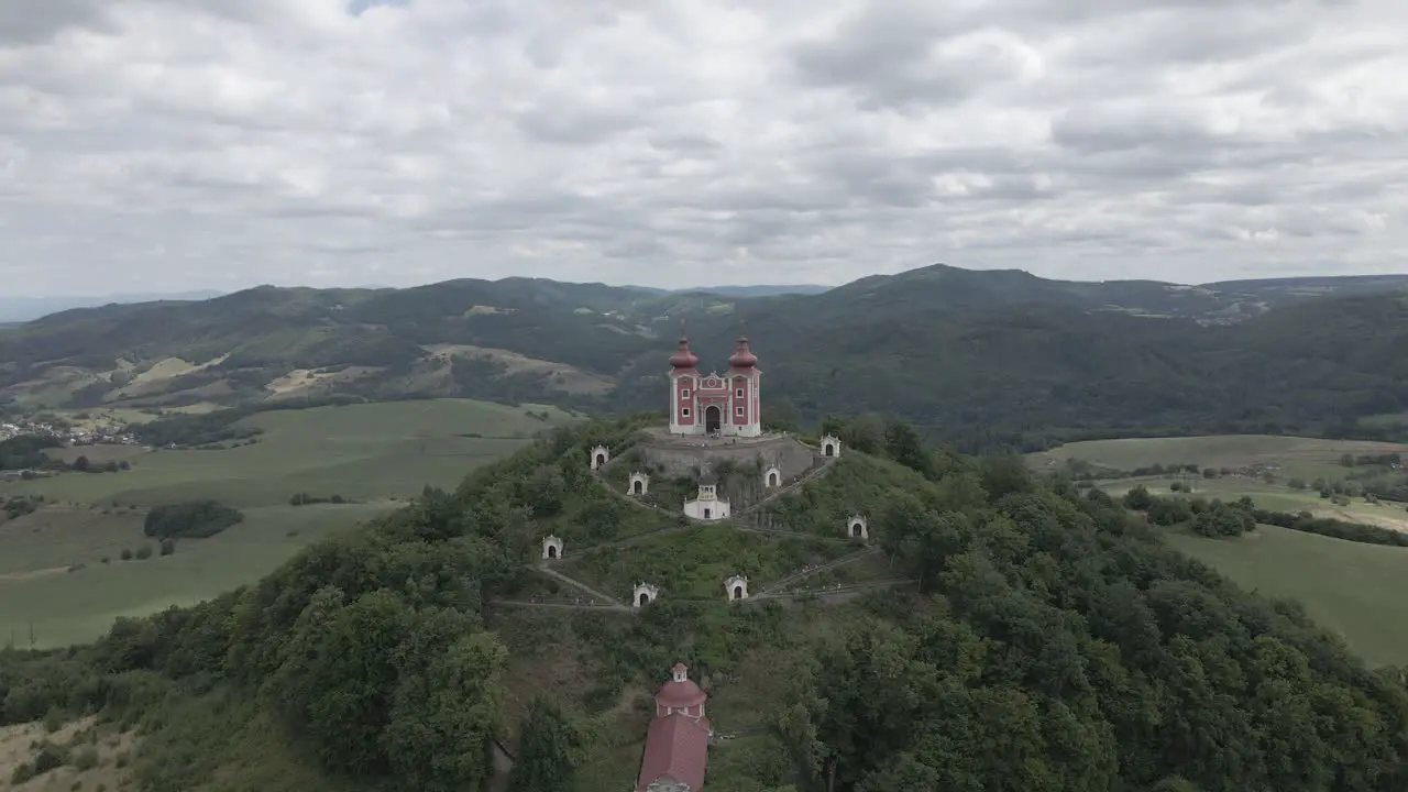 Small chapel with view on the mountains surrounded by