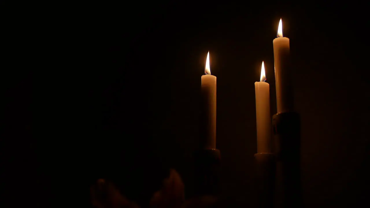 3 candles in the dark