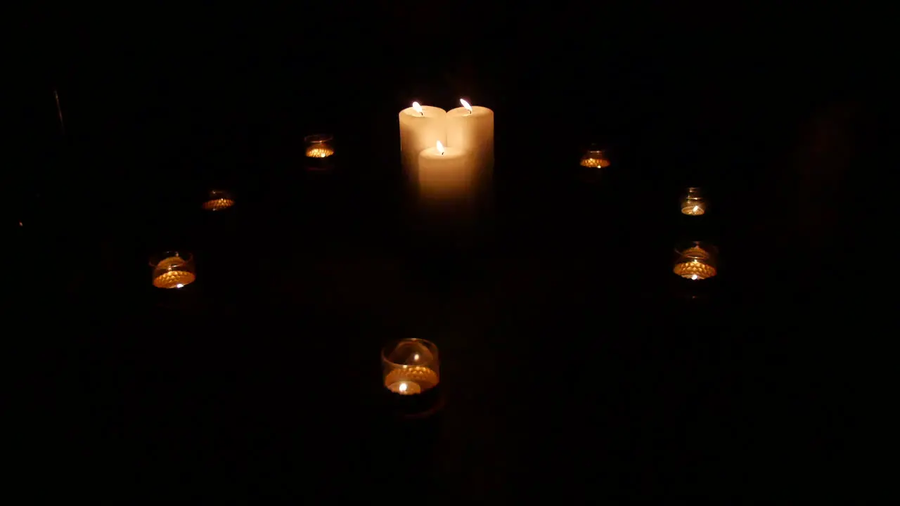 A circle of candles in the dark