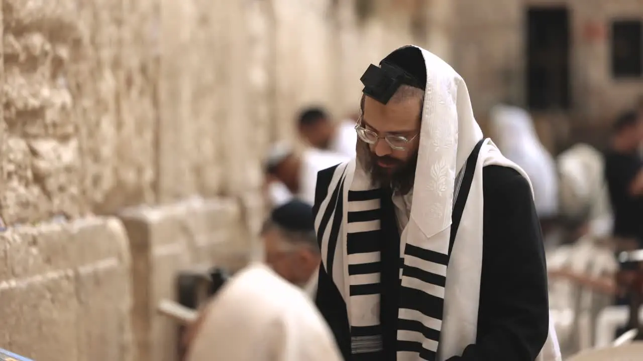 Silhouette Of Jewish Orthodox Man praying On Western Wall In Jerusalem