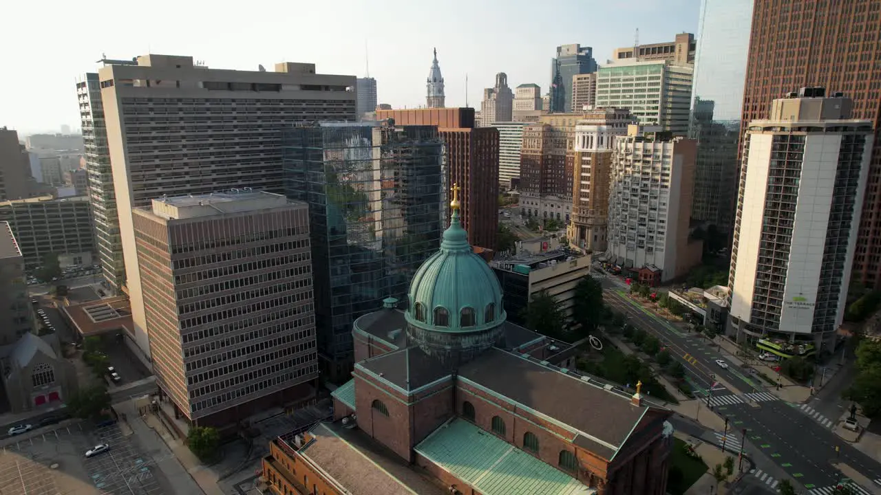 Catholic Basilica church Philadelphia descending and turning drone shot summer sunny golden hour morning