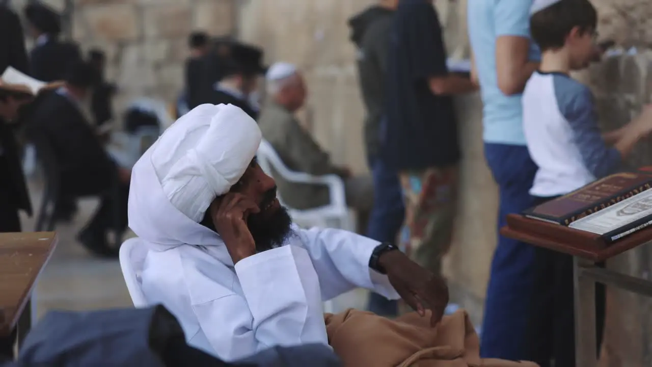 Portrait Of Muslim Ethnicity Man Sitting On Steps Of Mosque