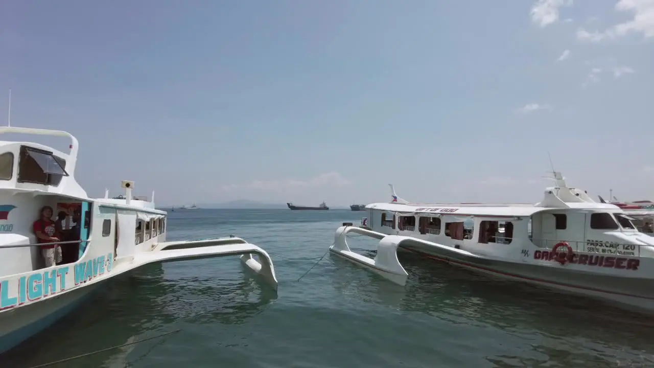 Multiple commuter ferries getting ready to board people