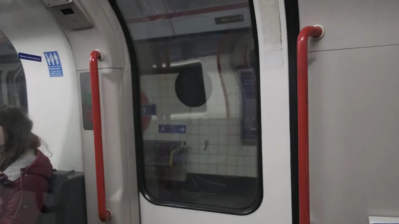 London Tube doors opening at Queensway underground station central line