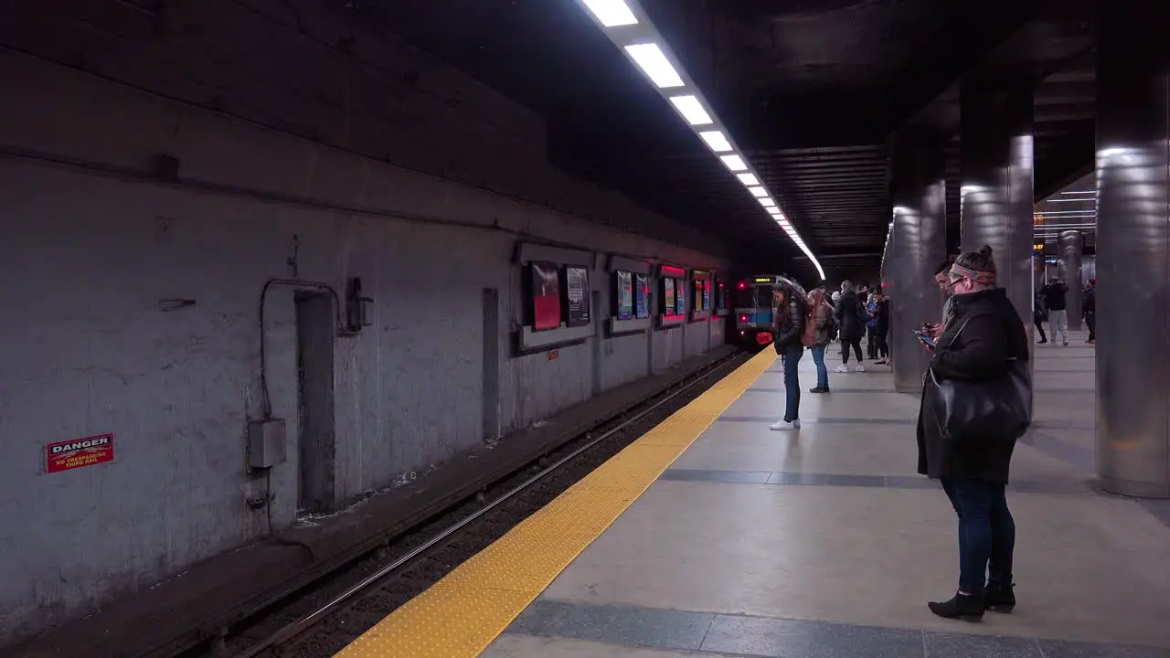 A mbta subway train arrives at a rapid transit station in Boston Massachusetts