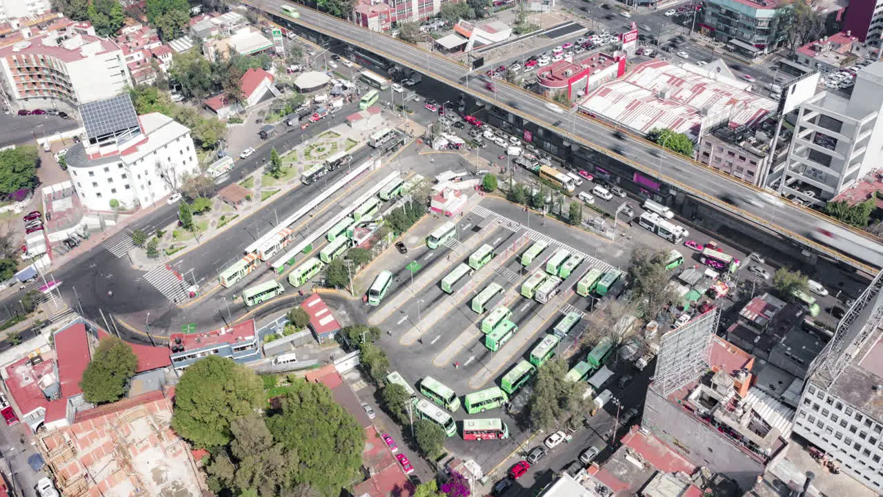 Aerial orbit hyeprlapse of the big bus stop of Mixcoac in Mexico City