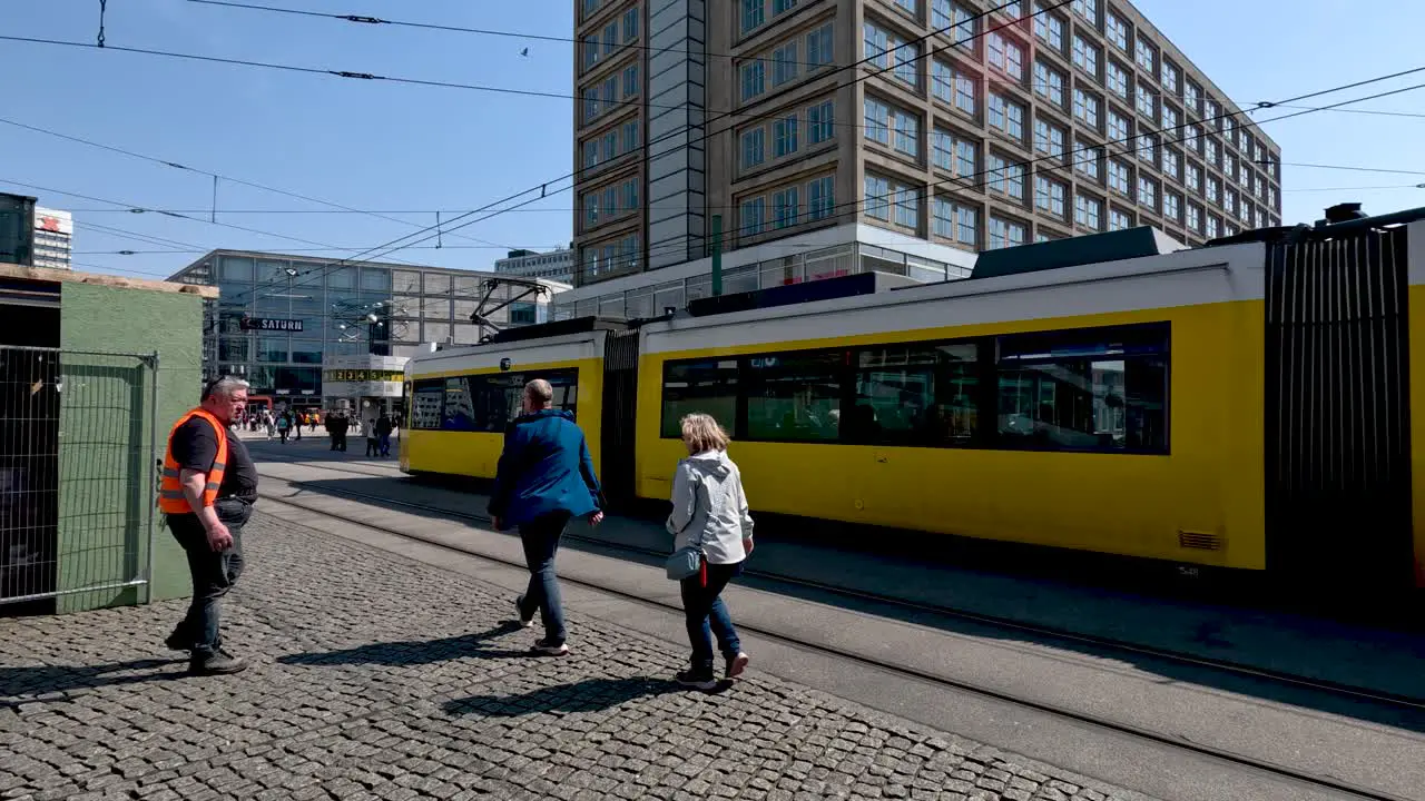 Yellow Tram Going Past At Alexanderplatz On Sunny Day In Berlin