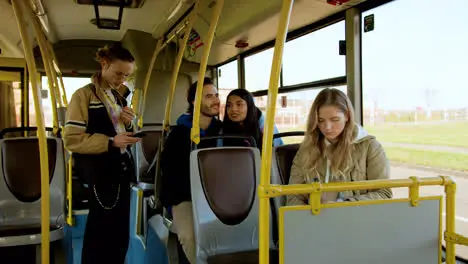 Young woman reading a book in the bus