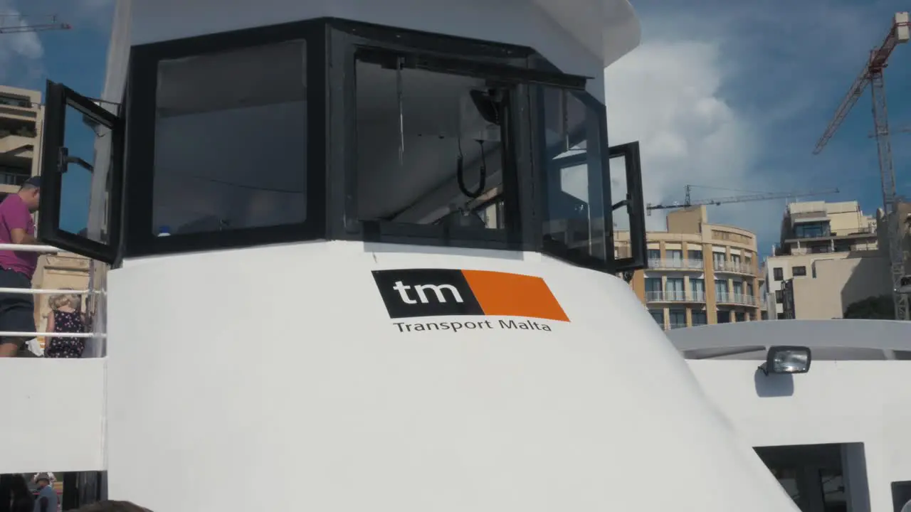 Close up shot of a taxi boat in Malta bringing people from Sliema to Valletta