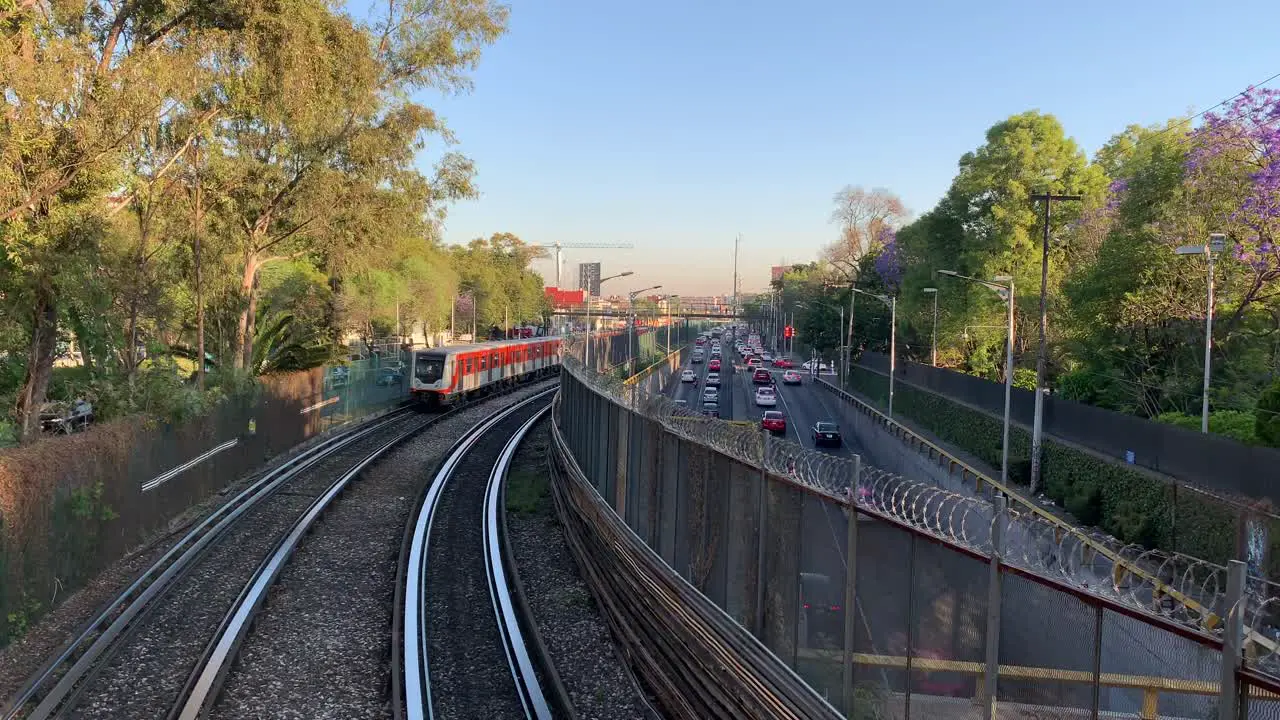 Elevated trains on their morning commute alongside Tlalpan Avenue in the southern part of Mexico City Mexico