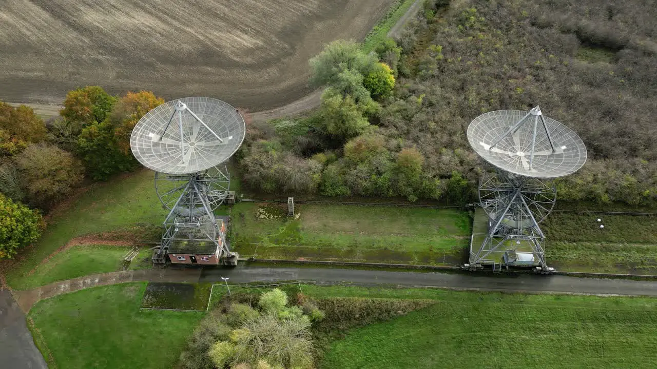 Aerial trucking shot of the antenna array at the Mullard Radio Astronomy Observatory a one-mile radio telescope