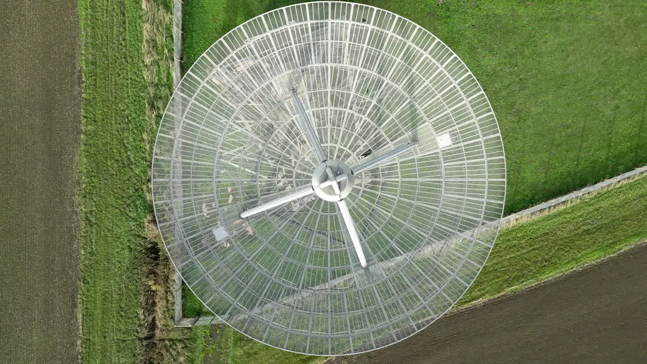 Aerial top-down shot of the modern radiotelescope antenna at the Mullard Radio Astronomy Observatory CCW rotation ascend