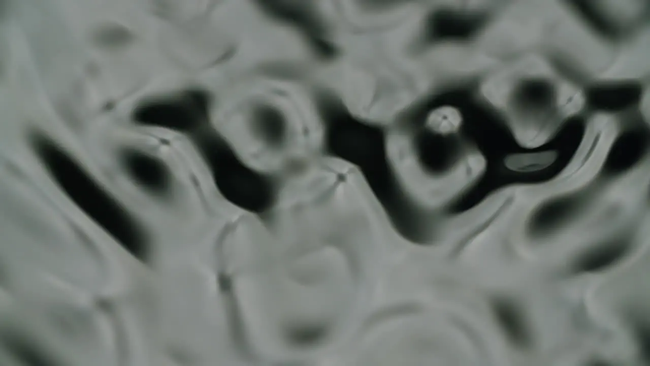 Extreme macro shot of water forming different waves and ripples