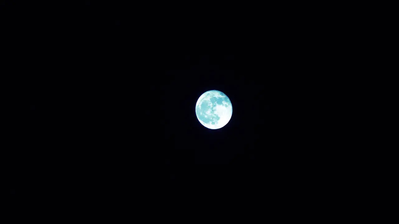 A blue moon in a clear night sky