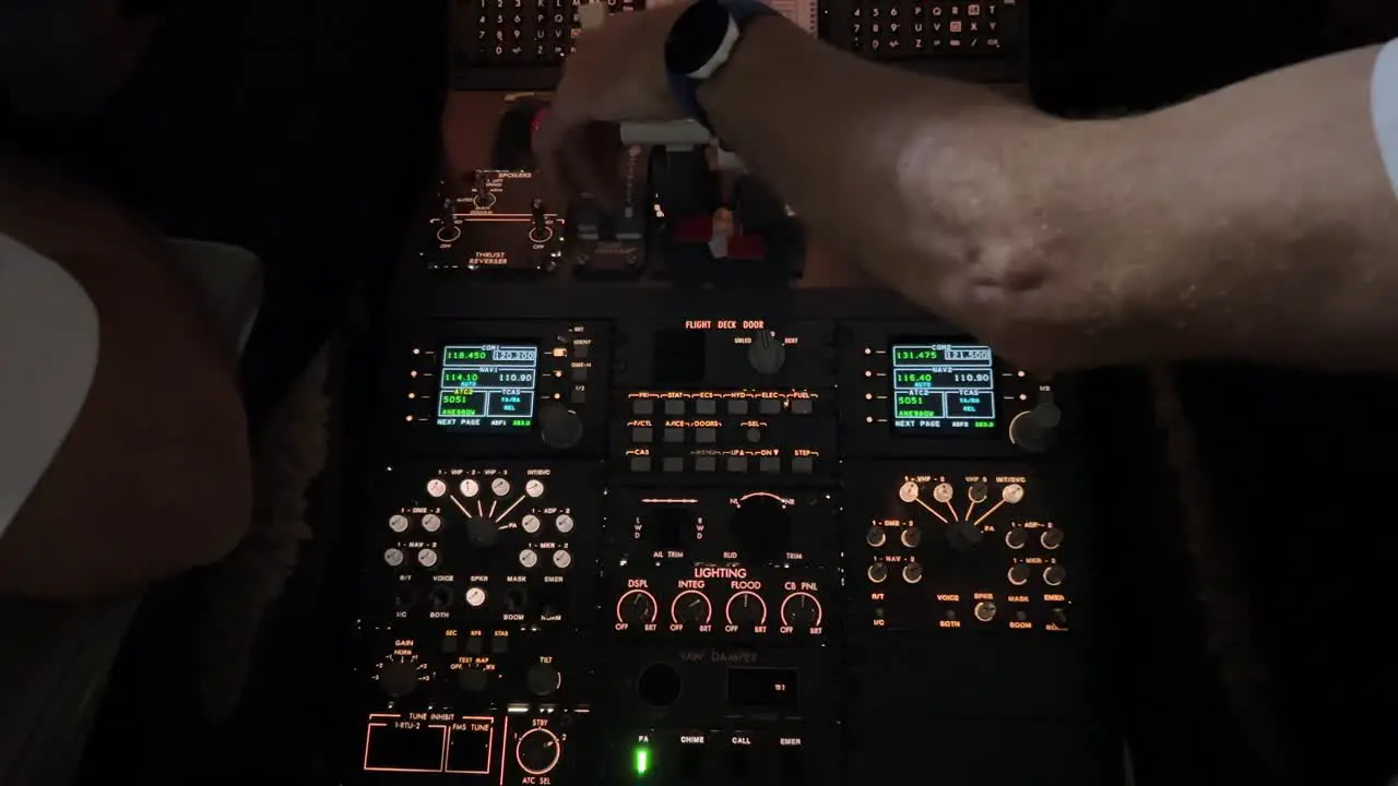 Cockpit inside view while copilot is starting-up left engine in a modern medium size jet