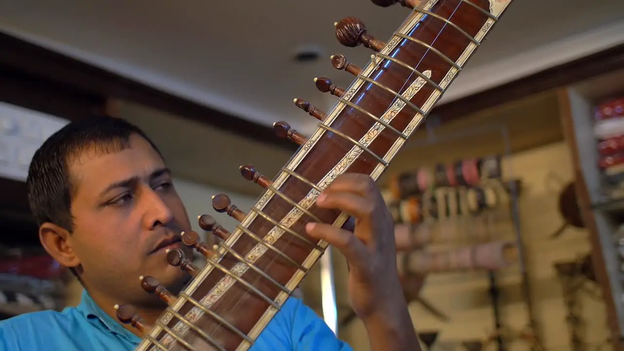 Man Playing a Sitar