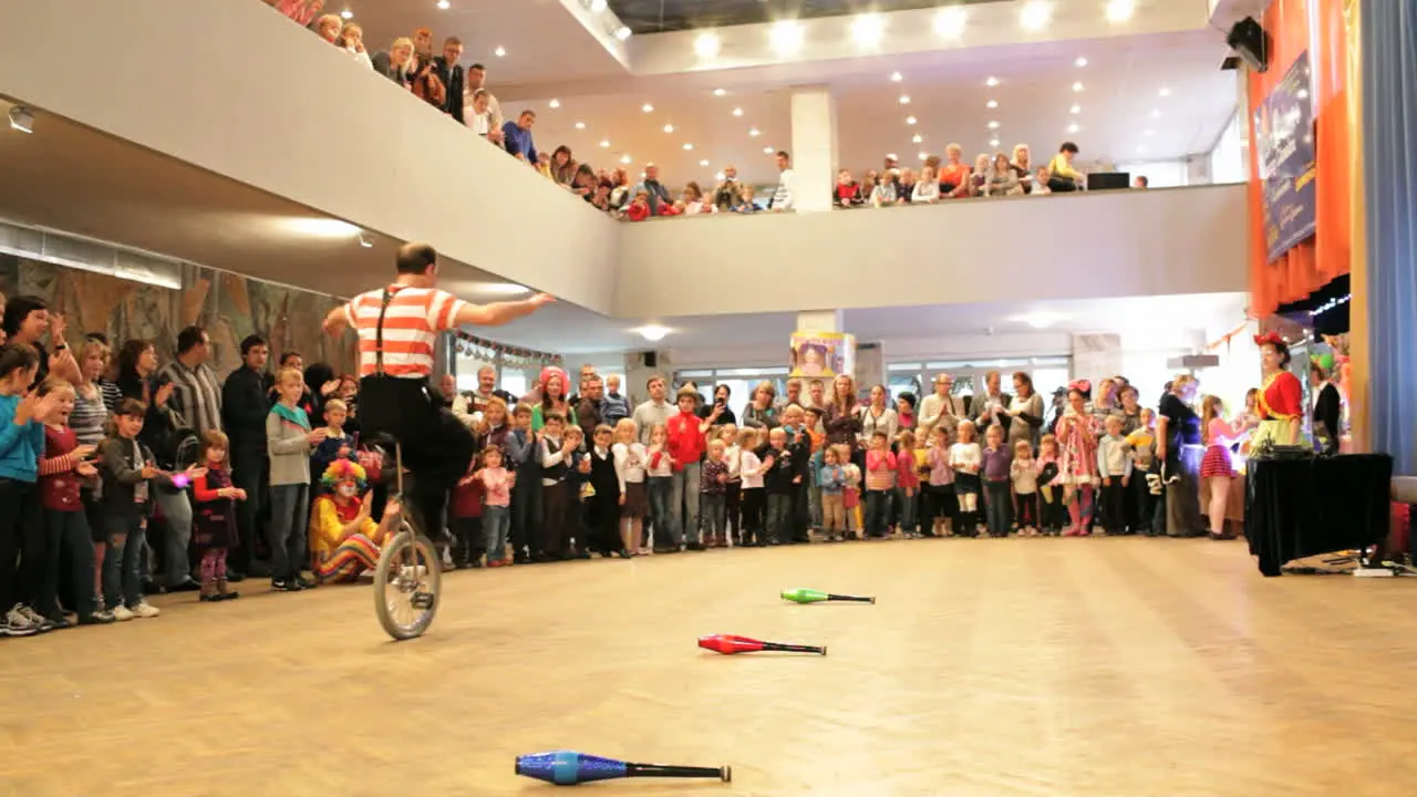 Clown riding a unicycle