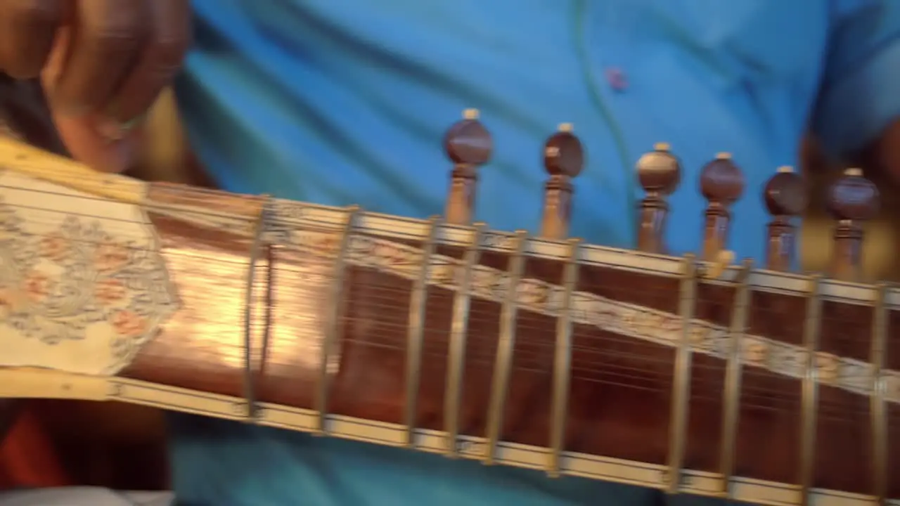 Man Tuning Sitar