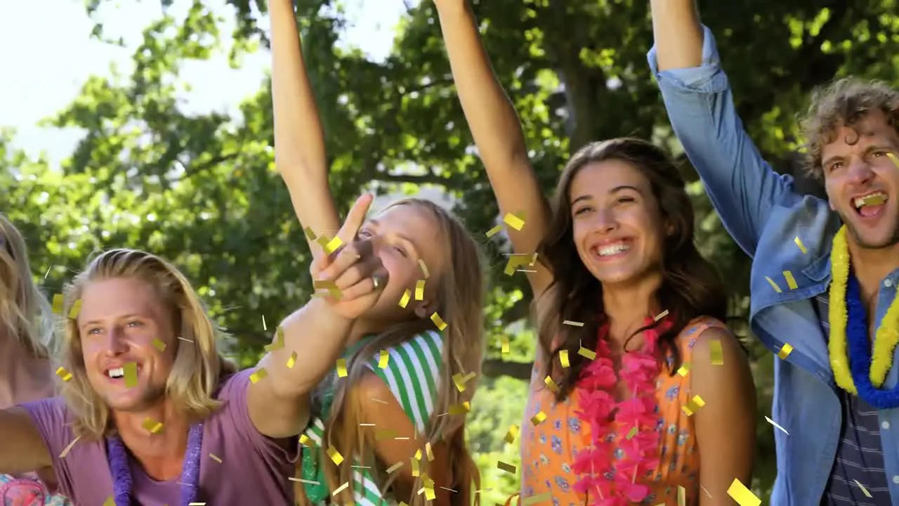 Animation of gold confetti falling over happy people smiling and celebrating outdoors