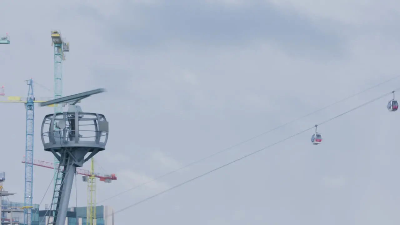 Cable cars traveling over river Thames in London