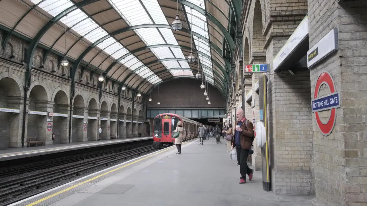 London District line underground train entering Notting hill gate tube station