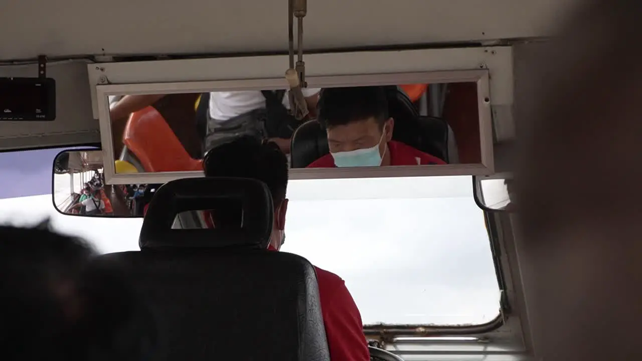 Transportation boat driver working and steering the boat on the Chao Phraya River in Bangkok Thailand