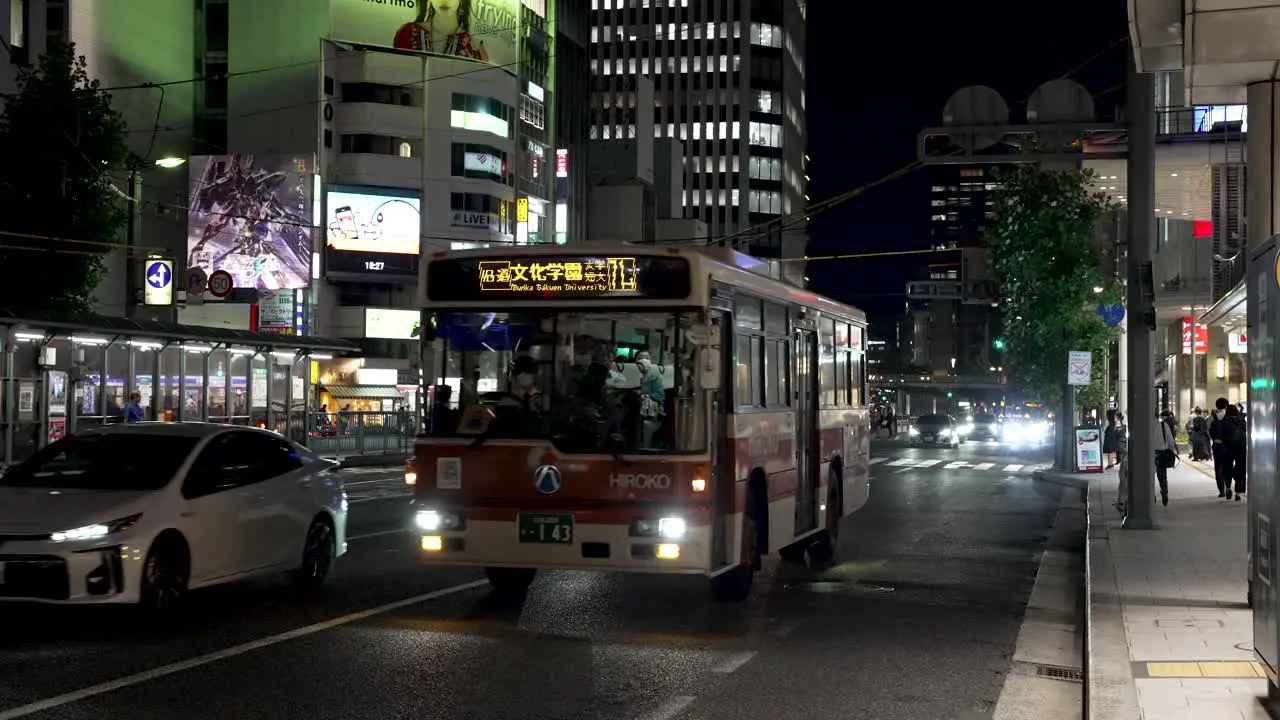 Local Bus Driving Past At Night In Hiroshima