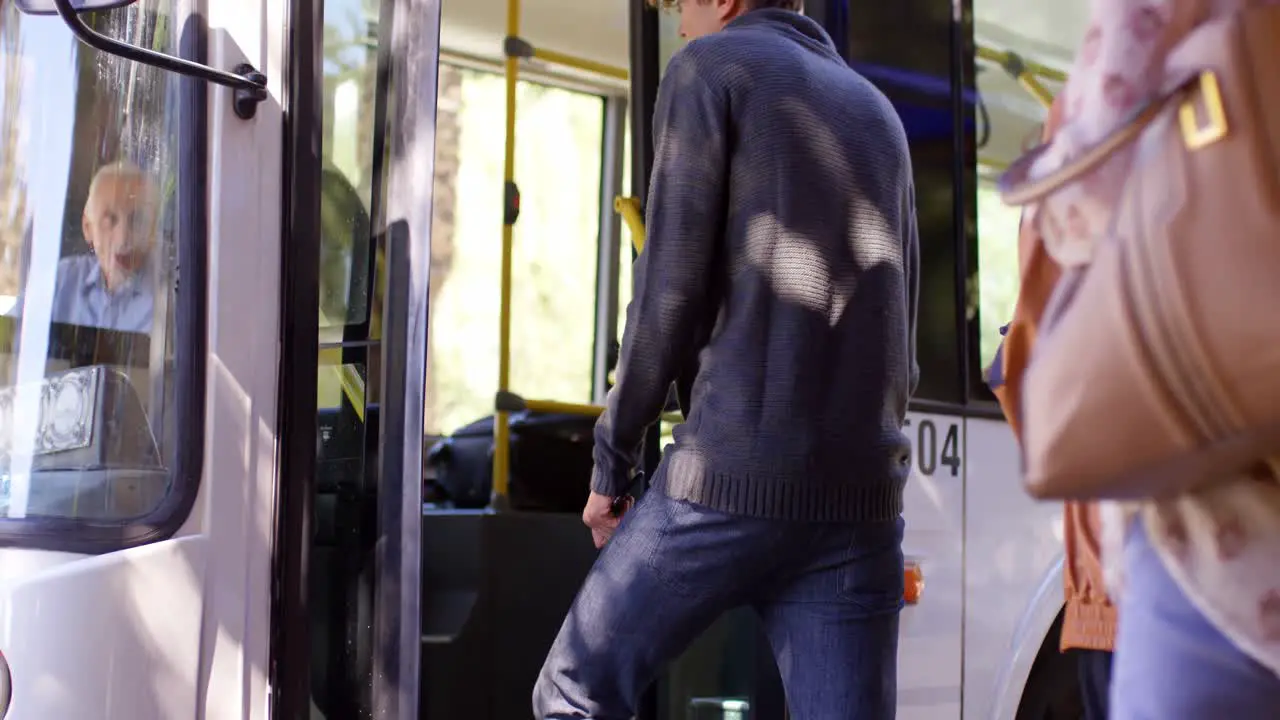 Commuters boarding bus 4k