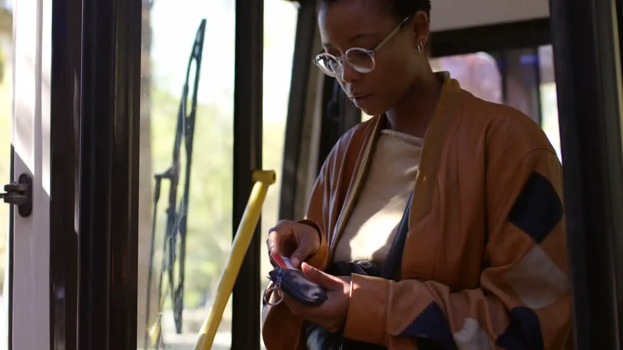 Female commuter getting out from bus 4k