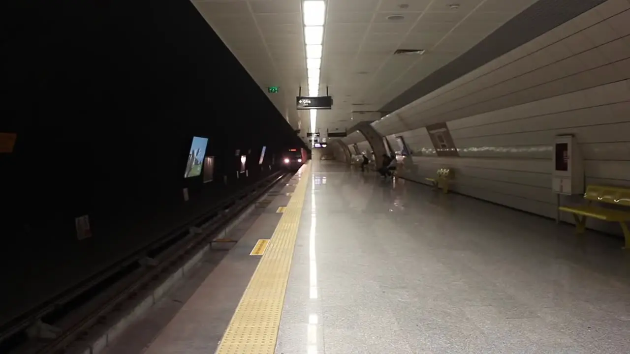 Underground Train Stops At A Platform And Passengers Embark And Disembark 1