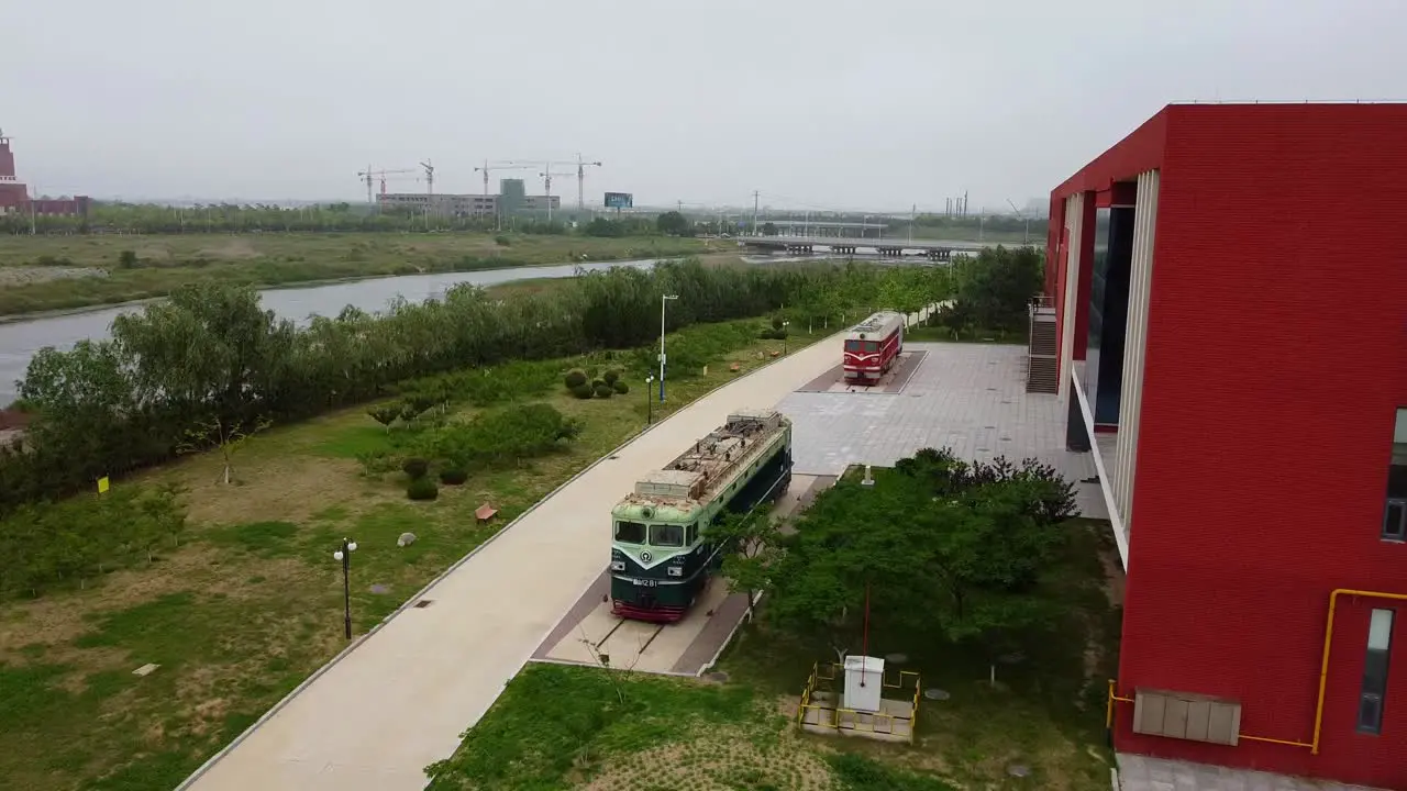 Aerial front view of two exposed locomotive vintage trains at Beijing Jiaotong University Weihai campus China