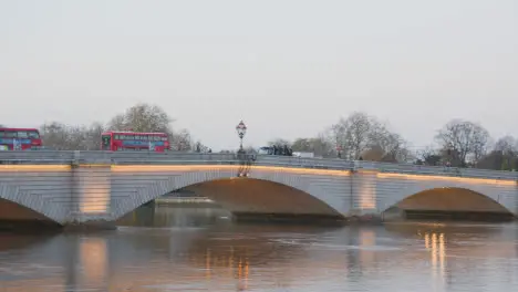 Putney Bridge Over River Thames In London Illuminated In Winter With Buses 1