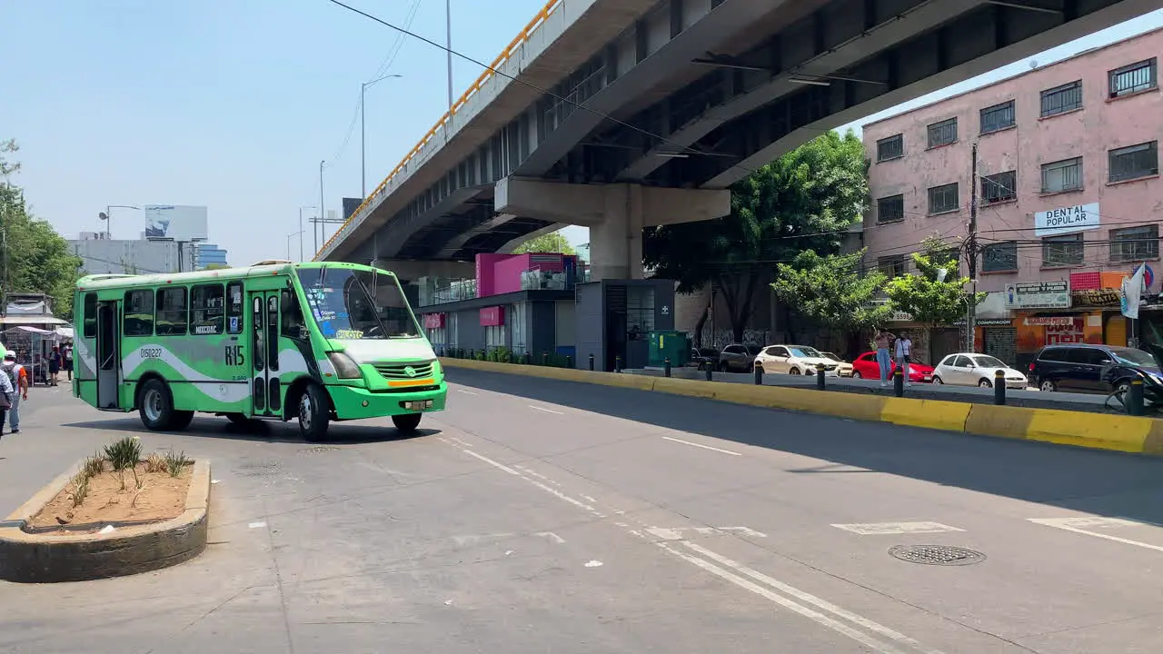 Traditional Mexican Green Public Transport Bus Known As La buseta Leaving Bus Station In Beside Overpass In Mexico City