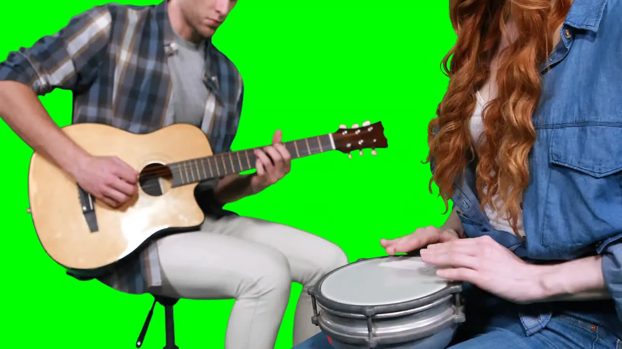 Musicians playing guitar and drum