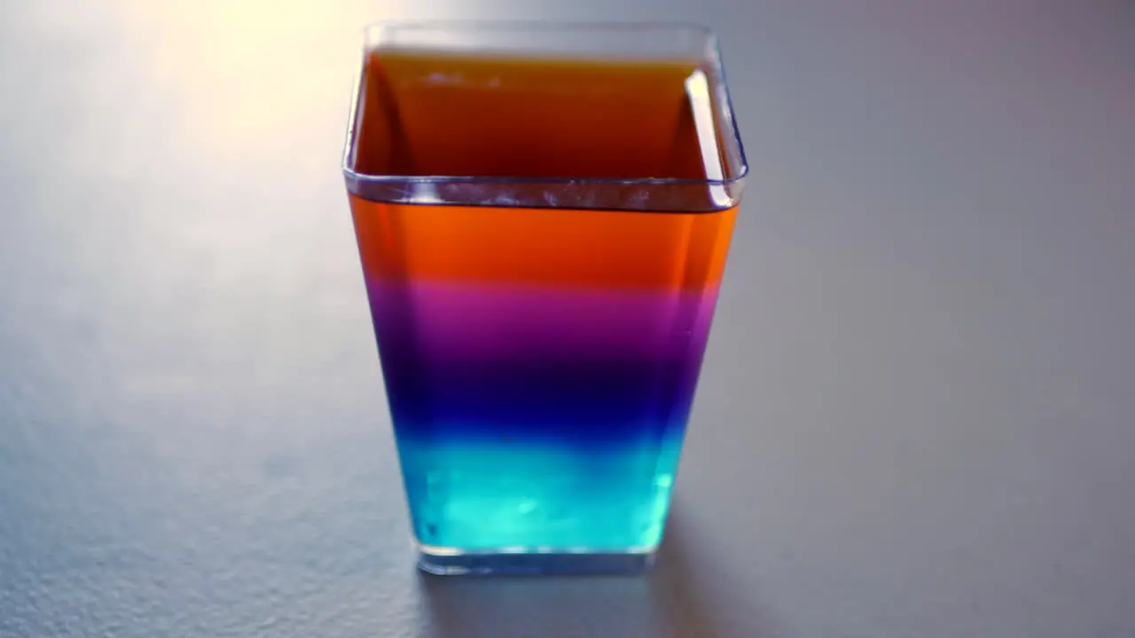 Rainbow jelly in a rectangular shaped cup