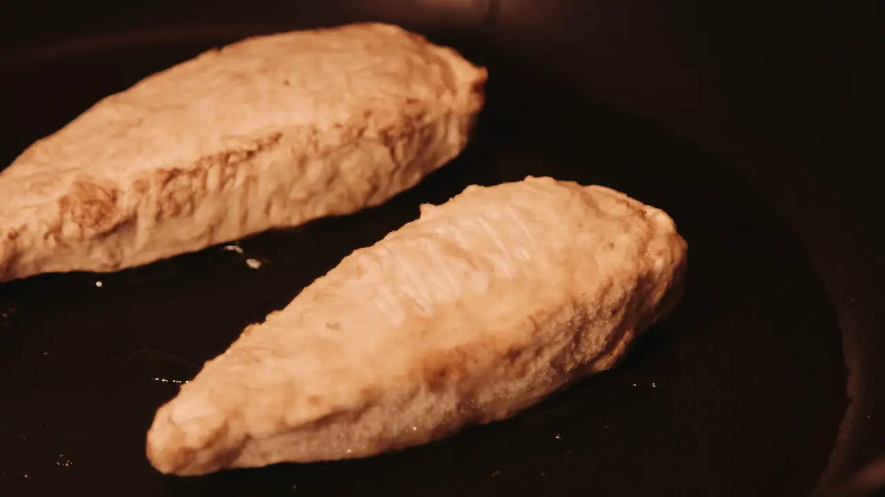 Vegan Chicken Fillets Sizzling in Oil in Hot Frying Pan