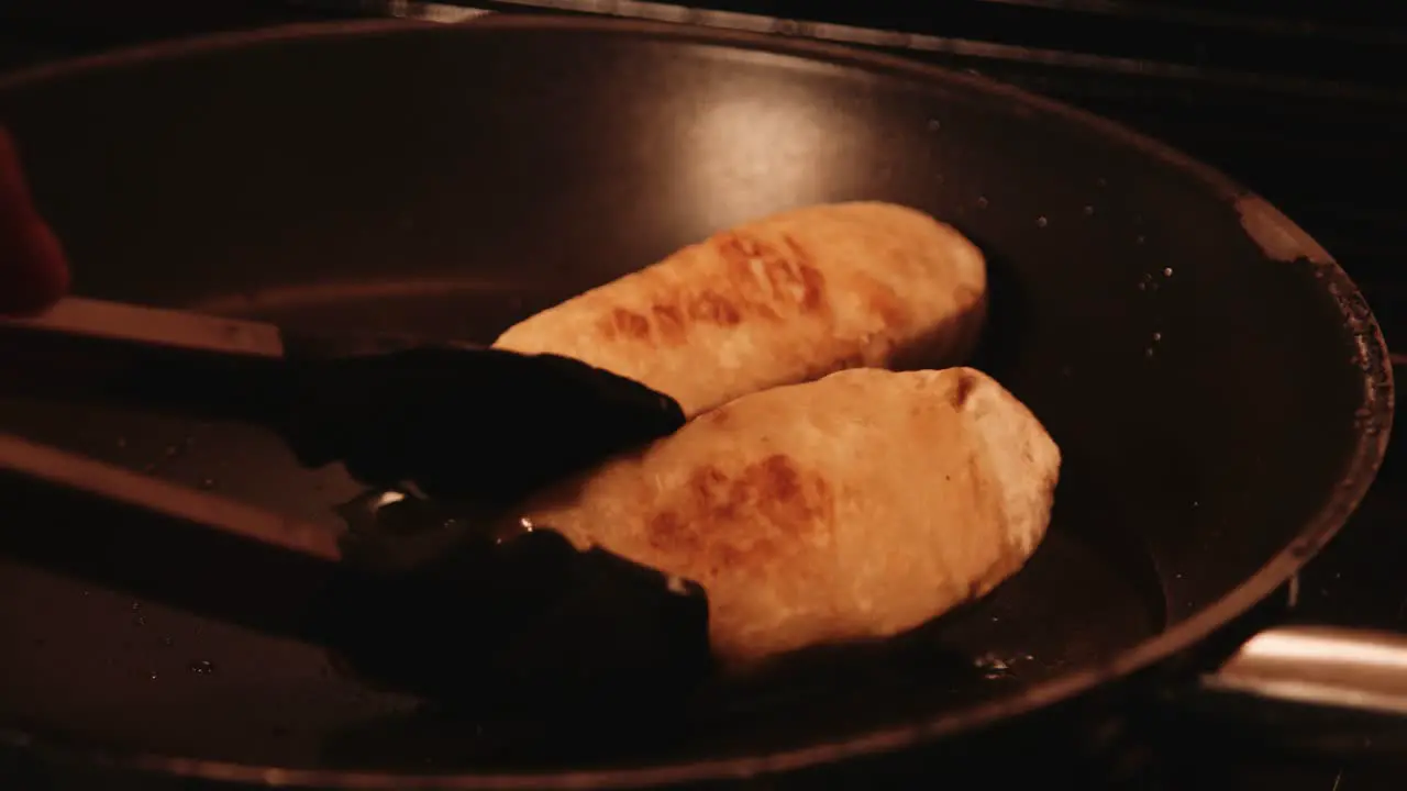 Vegan PlantBased Chicken Fillets Being Flipped by Chef with Tongs