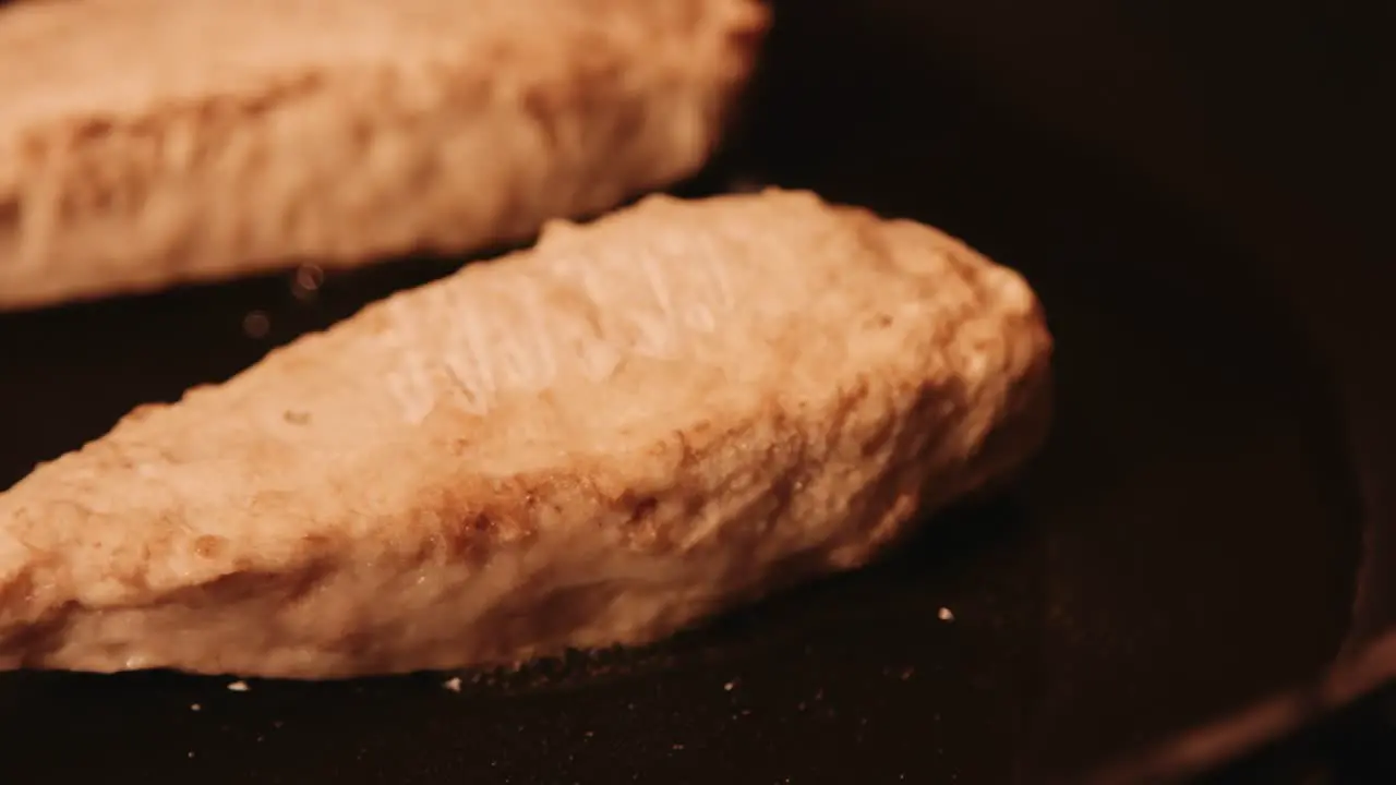 Slow Pan of Vegan Chicken Fillet Being Cooked