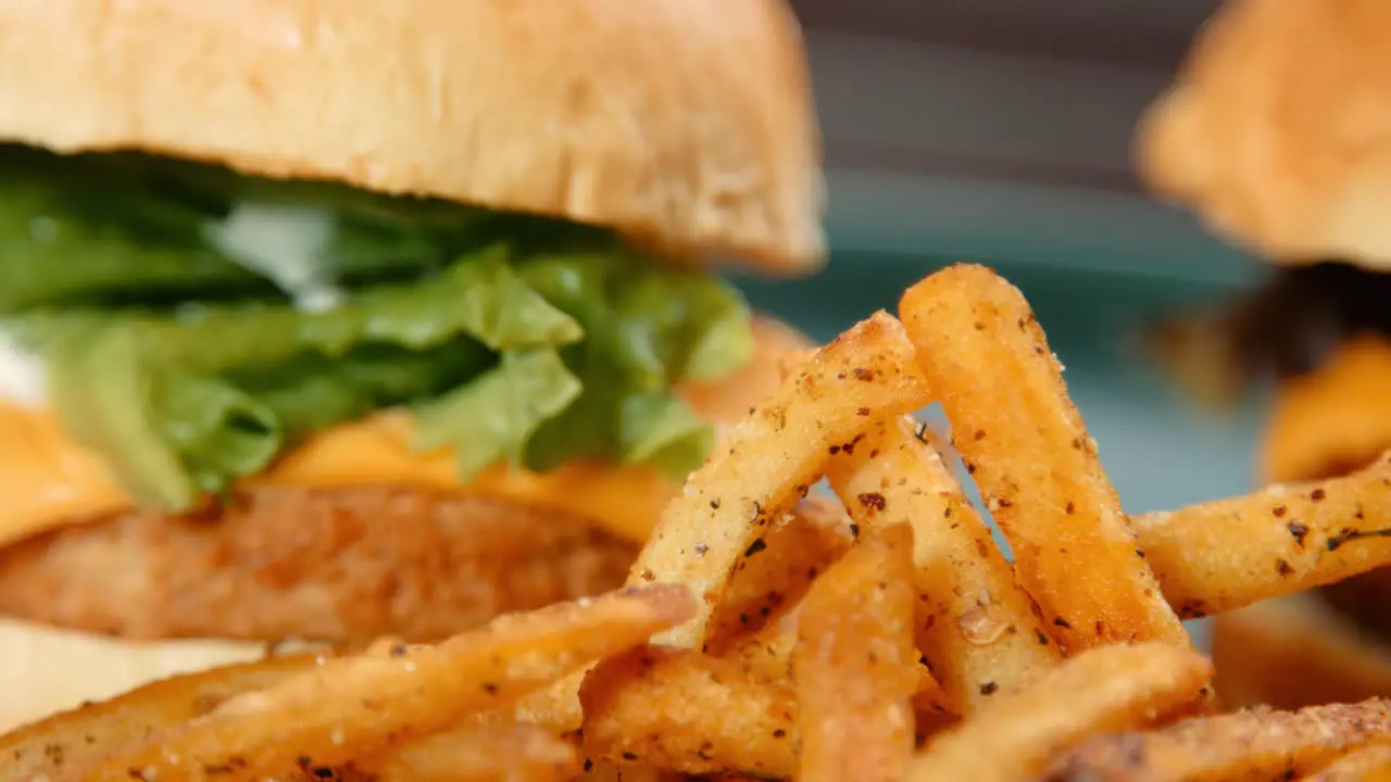 Close Up Pan of French Fries Chips with Meat Free Chicken Burger and Cheese Burger