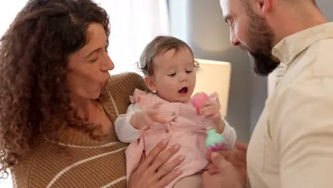 Happy love and family in bedroom with baby