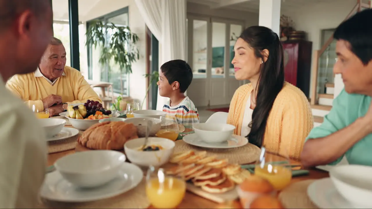 Big family lunch and talking at dinner table